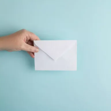 person showing white envelope