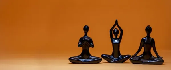 a group of three statues sitting next to each other